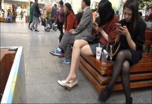 Dangling Woman Focused Phone and Ignore Her Legs